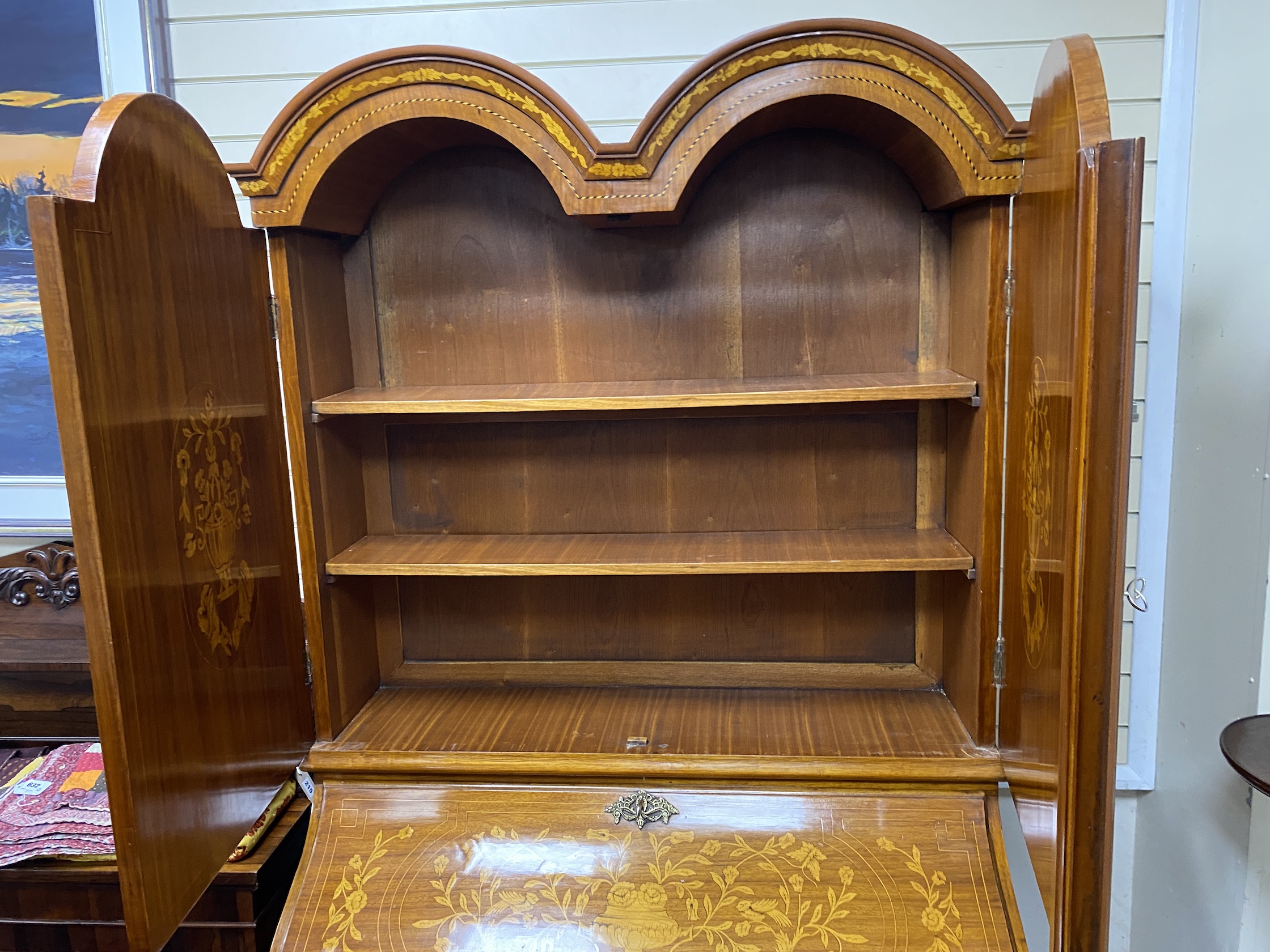 An 18th century style Dutch design marquetry inlaid bombe bureau cabinet, width 110cm, depth 64cm, height 208cm